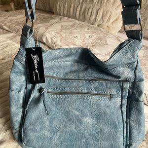Leather shoulder bag with adjustable crossbody option